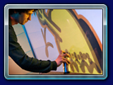 Graffiti Wall - It's unique. It is the perfect interactive addition to any party, special event or promotion. Using our VGW photo booth allows your guests to take giant-sized photos of themselves. Then they use spray paint cans to virtually draw on their own photos or custom background and make giant works of art. Their creations are printed instantly as promotional party favors that can be branded.